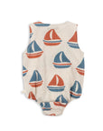 Baby romper with sailboat pattern on a white background