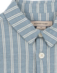 Close-up of a blue and white striped shirt with a visible brand label.