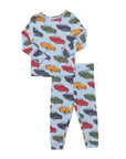 A two-piece children's pajama set featuring a light blue long-sleeve top and matching pants, both printed with a colorful retro car pattern.