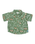 A short-sleeve button-up shirt for kids, featuring an all-over football field and football pattern in green, white, and brown, laid flat against a white background.