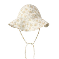 Floral patterned baby sun hat on a white background