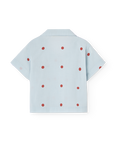 Light blue shirt with red polka dots on a white background