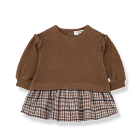 Brown sweater with plaid skirt on a white background