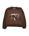 Brown sweatshirt with a graphic of a wolf and mountains on a white background