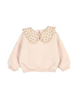 A pale pink long-sleeve sweatshirt for a toddler, featuring a large, wide scalloped Peter Pan collar decorated with a small floral pattern.