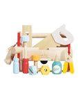Toy tool set with various tools and a glue bottle on a white background