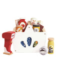 Set of toy kitchen items including a cash register, cups, and bottles on a white background