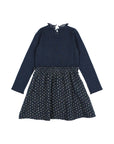 A long-sleeve children's dress with a dark navy ribbed knit top and a pleated skirt featuring a small beige floral pattern, shown on a light gray background.