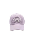 Lavender cap with 'LITTLE SIS' text on a white background