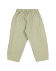 A pair of light sage green pants with an elastic waistband and drawstring, laid flat against a light gray background.