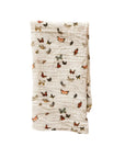 Muslin cloth with butterfly pattern on a light pink background
