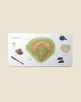 Educational book about baseball with illustrations of various baseball equipment on a beige background