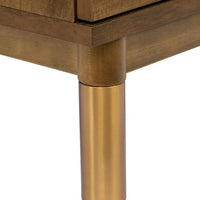 Wooden furniture leg with gold finish on a white background