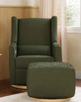 Green armchair with matching ottoman in a room with wooden side table and window.