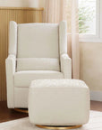 Beige armchair with matching ottoman in a room with wooden floor and window.