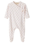Baby onesie with long sleeves and footies on a white background