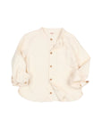 A cream-colored long-sleeve button-up shirt with rolled cuffs and a chest pocket, laid flat on a light gray background.