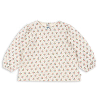 Baby bib with floral pattern on a white background