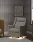 Nursery room with a gray armchair, crib, and changing table.