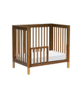 GELATO 4-IN-1 CONVERTIBLE MINI CRIB - NATURAL WALNUT AND GOLD FEET