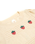 Beige sweater with strawberry embroidery on a white background