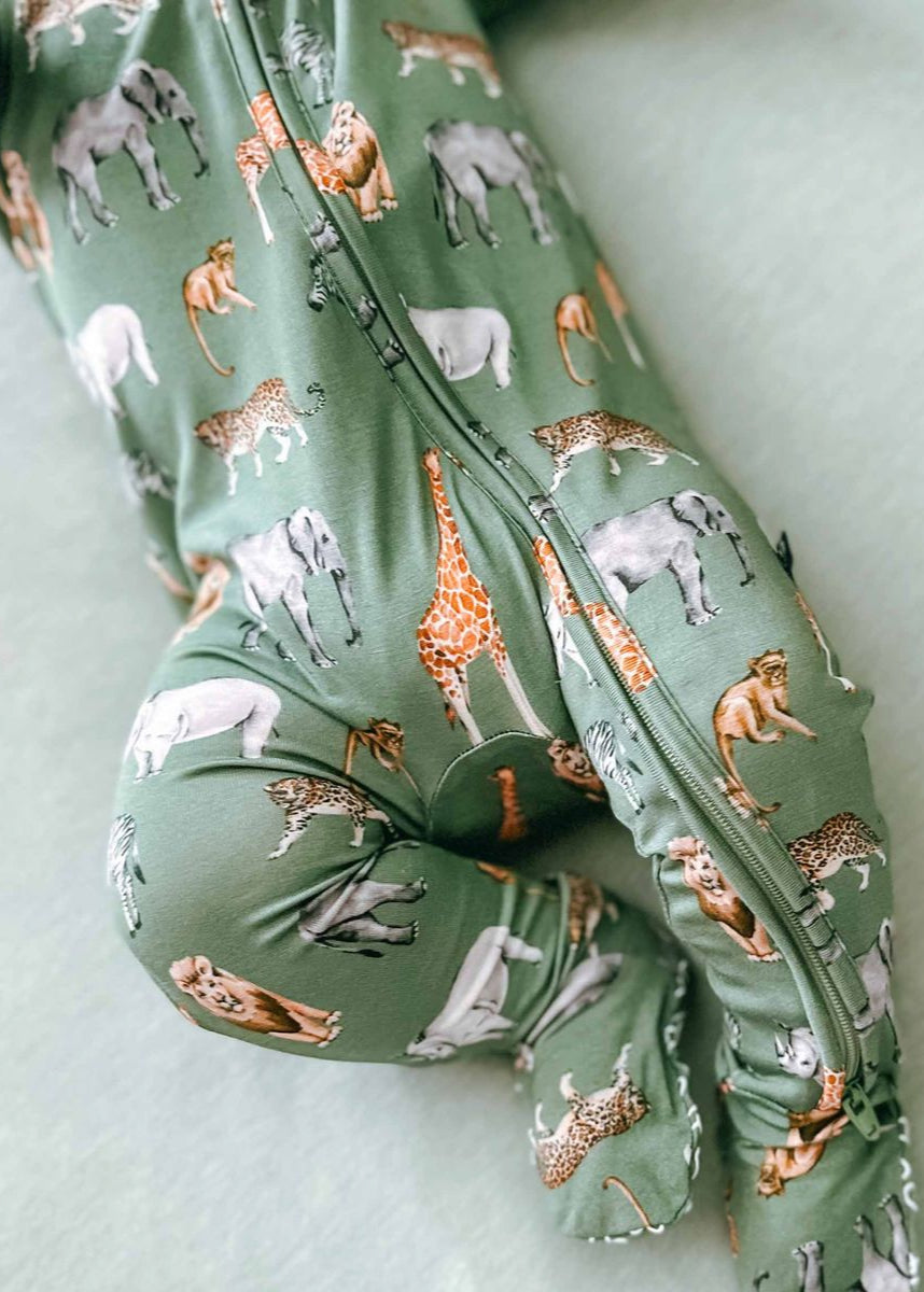 Green fabric with animal pattern on a light green background