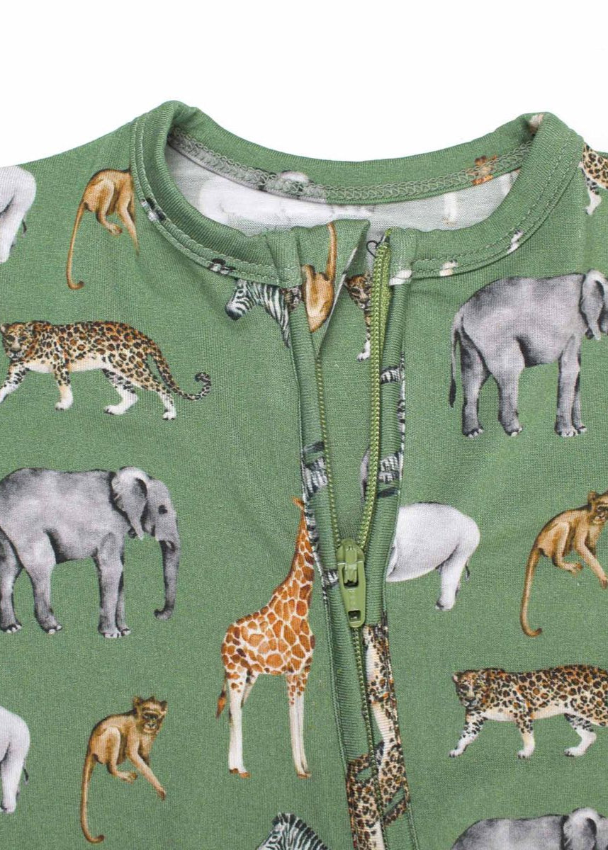 Green baby onesie with animal pattern on a white background