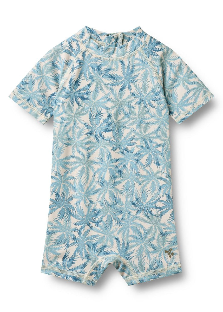 Blue and white floral patterned romper on a white background