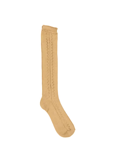 A single knee-high knit sock in a warm tan or camel color, featuring vertical openwork lace-like patterns, shown against a plain white background.