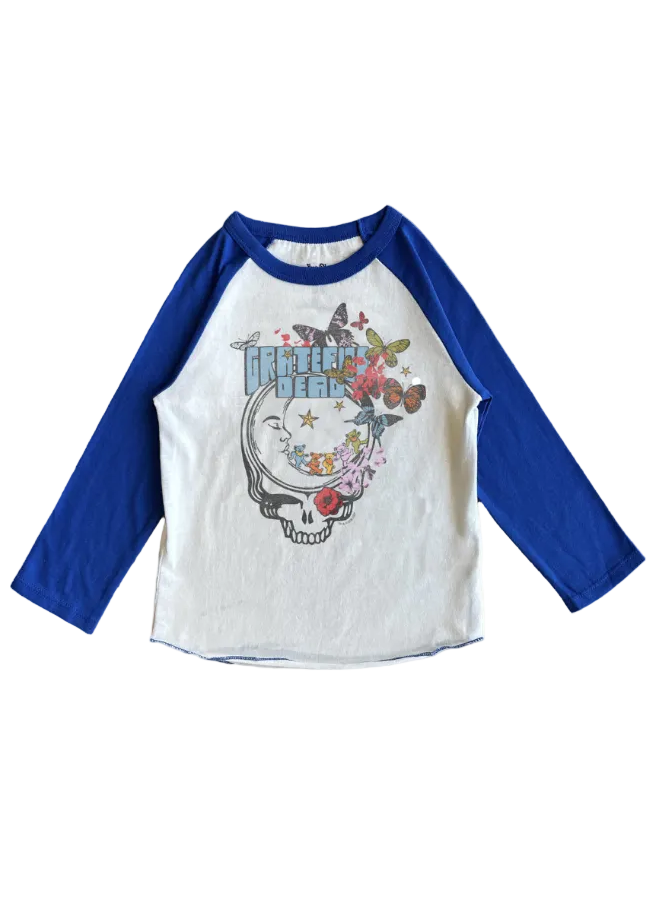 A white and royal blue raglan baseball t-shirt featuring a 'Dreamer Dead' graphic on the front with a skull, moon, butterflies, and flowers.