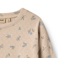 Beige sweatshirt with floral pattern on a white background