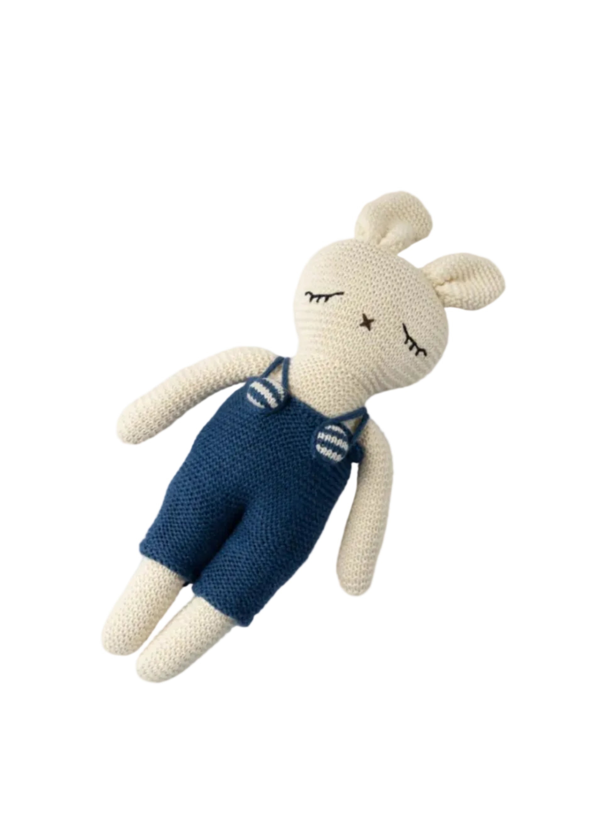 Knitted toy rabbit wearing blue overalls on a light gray background