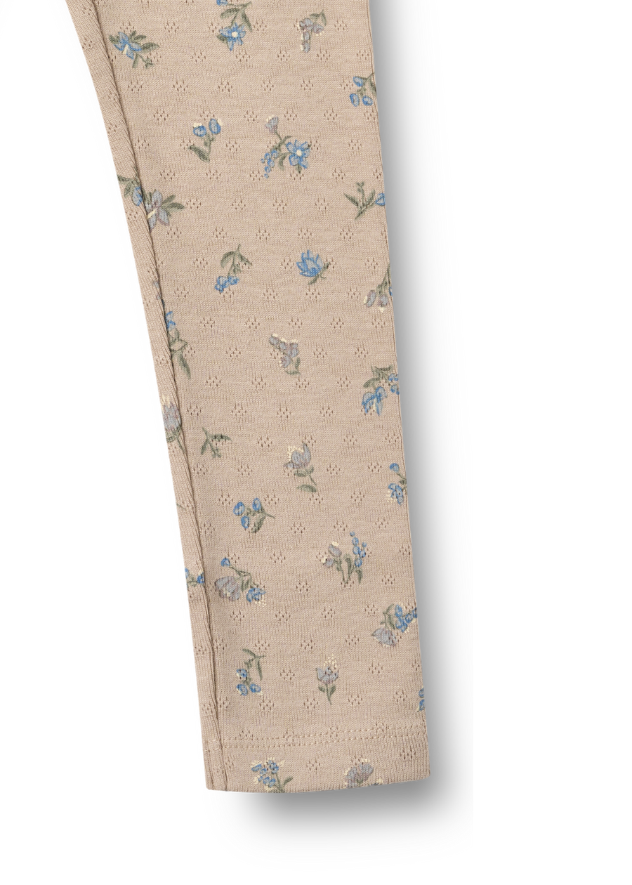 Beige pants with floral pattern on a white background