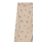 Beige pants with floral pattern on a white background