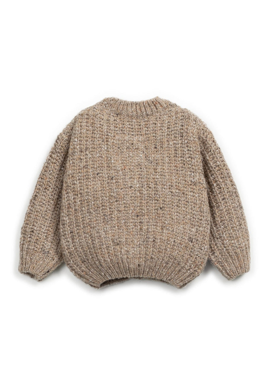 Knitted sweater with bunny ears on a white background