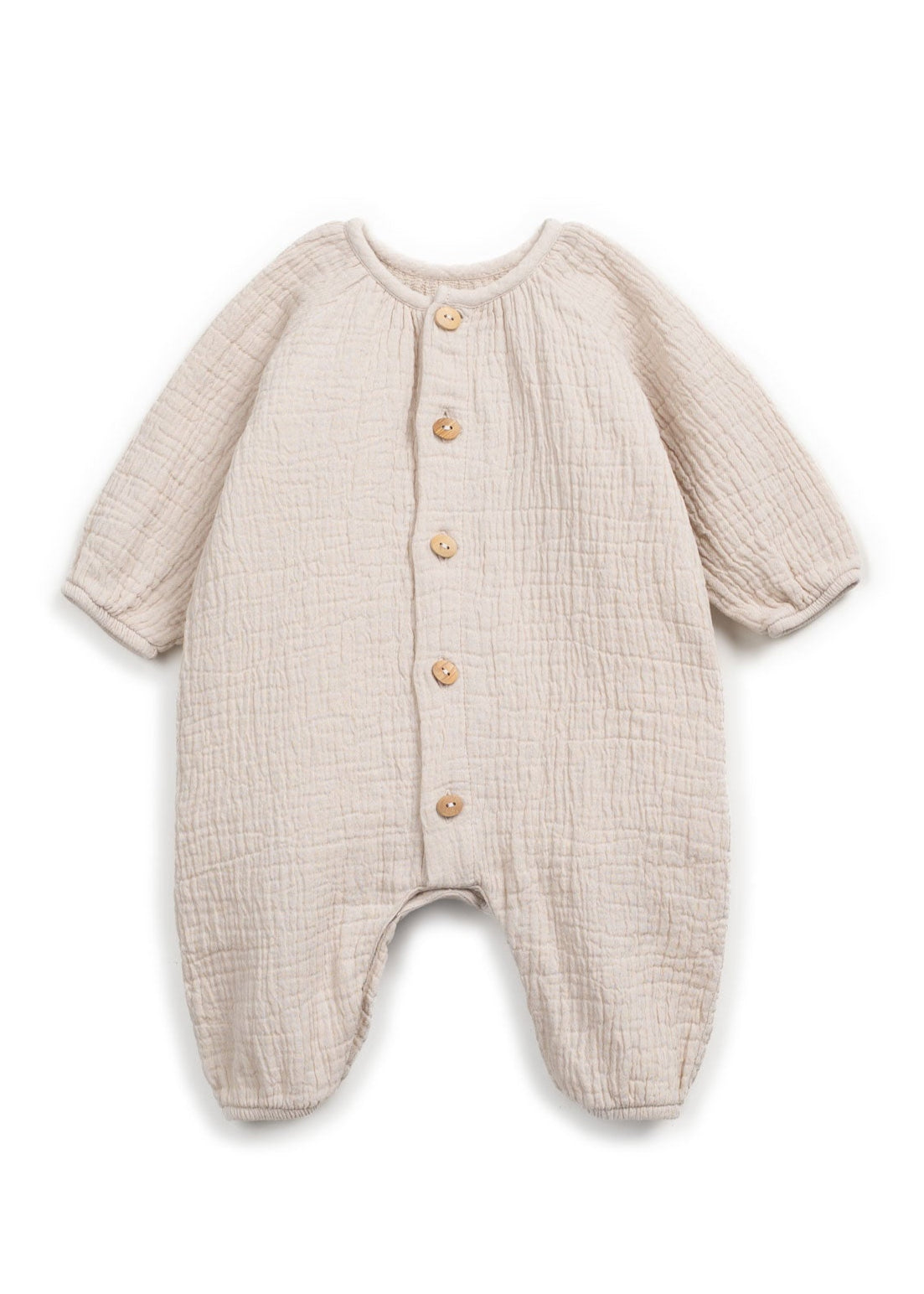 Beige baby onesie with button details on a white background