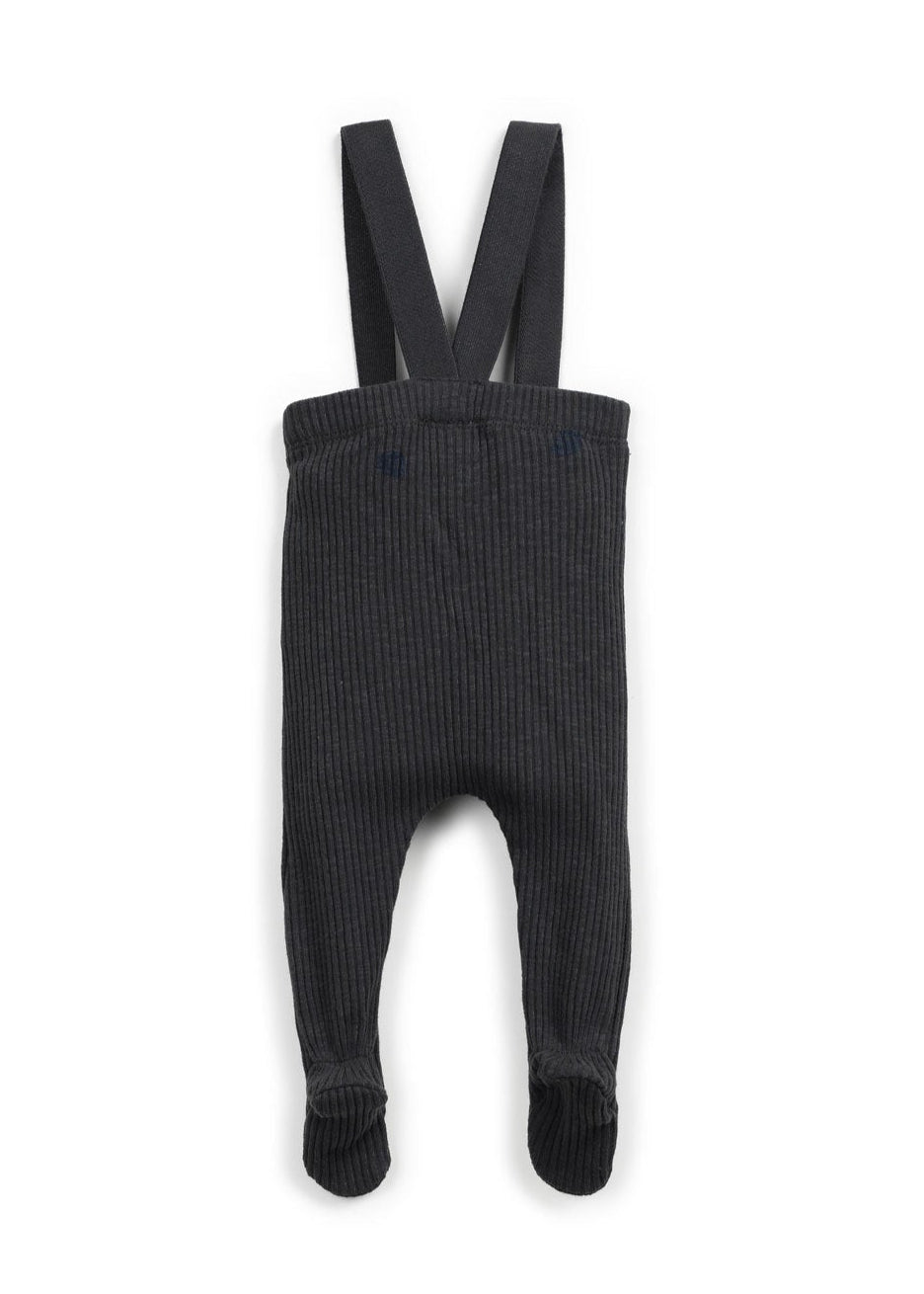 Black ribbed baby romper with suspenders on a white background