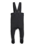 Black ribbed baby romper with suspenders on a white background