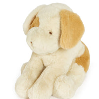 Plush toy dog with beige and brown fur on a white background