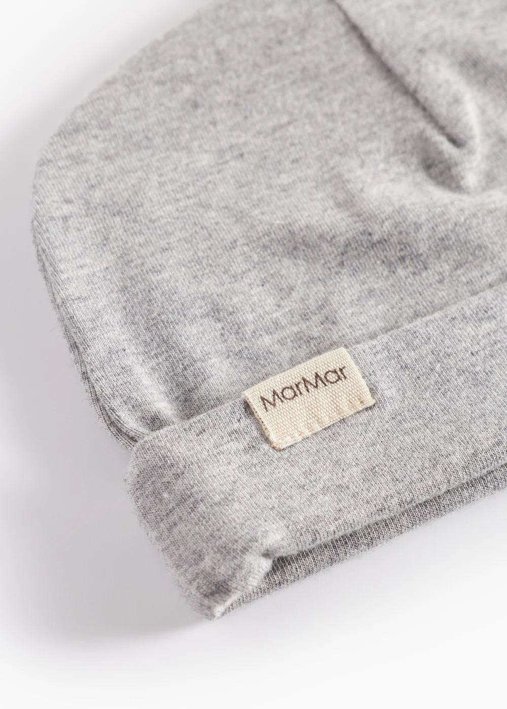 Gray fabric with a brand label on a white background