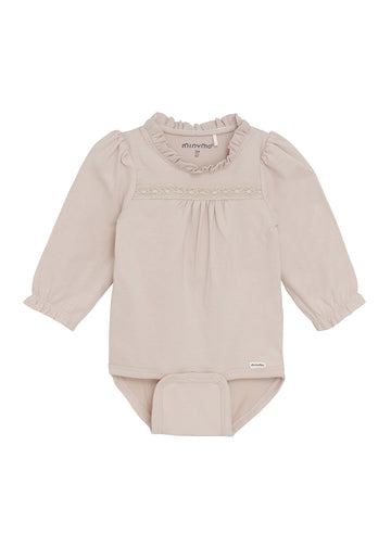 Baby outfit with long-sleeve top and pants on a white background