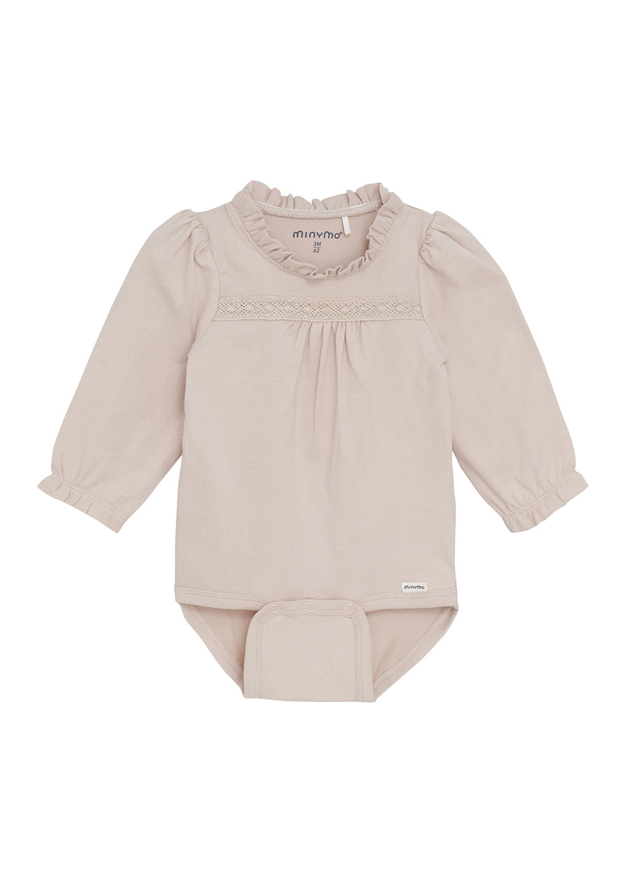 Baby outfit with long-sleeve top and pants on a white background