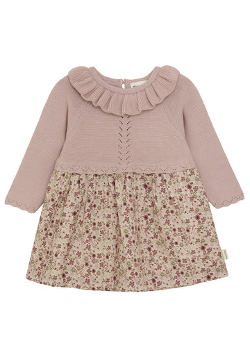 Two-tone dress with ruffled collar and floral skirt on a white background