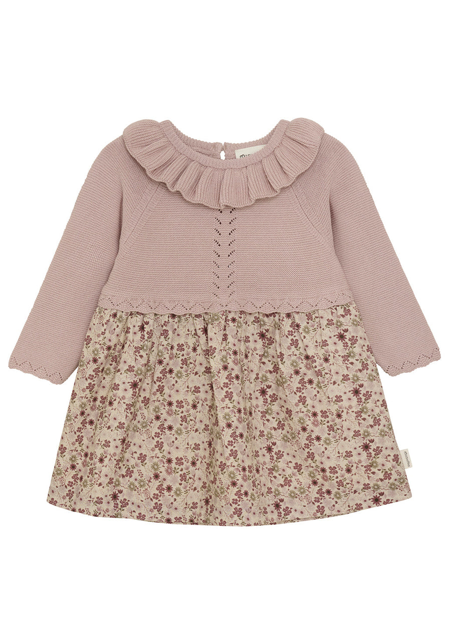 Two-tone dress with ruffled collar and floral skirt on a white background