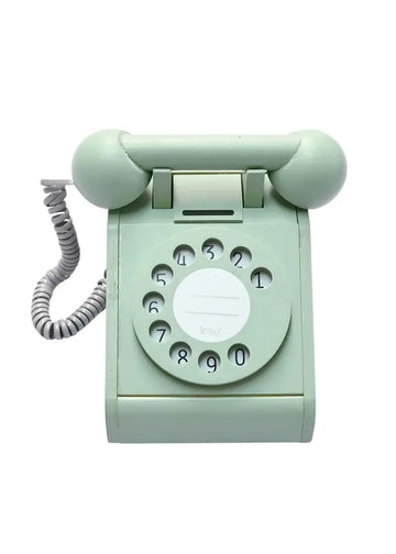 Mint green rotary phone on a white background