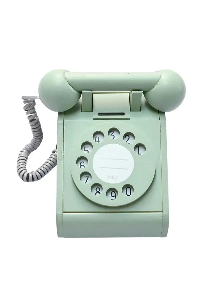 Mint green rotary phone on a white background