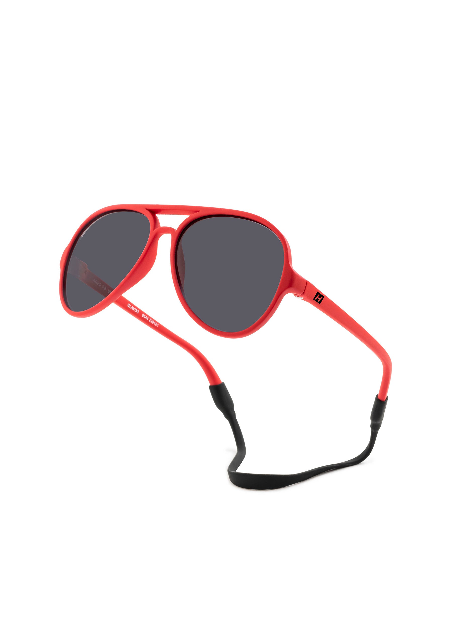 Red sunglasses with a black strap on a white background