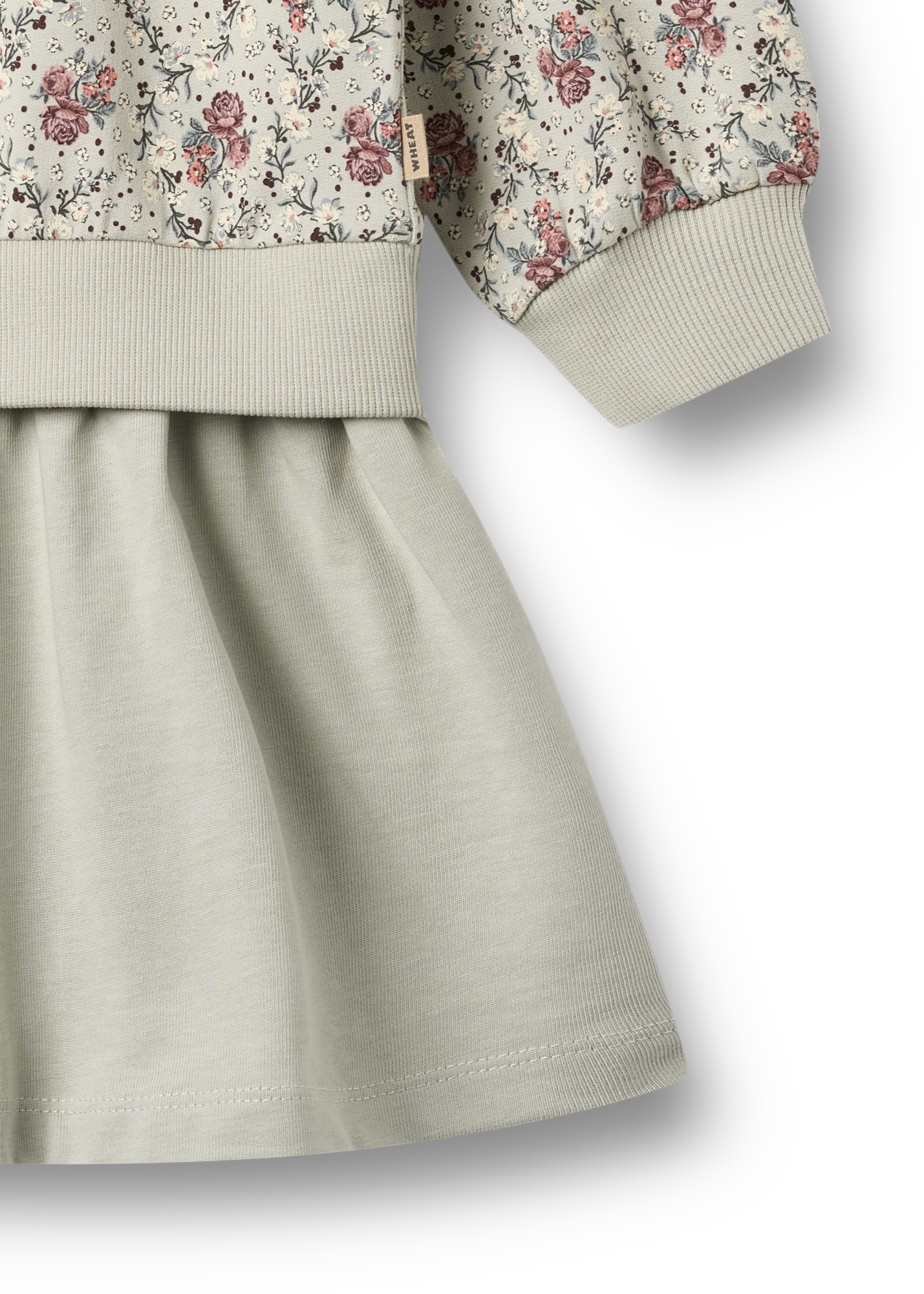 Children's outfit with floral jacket and beige skirt on a white background