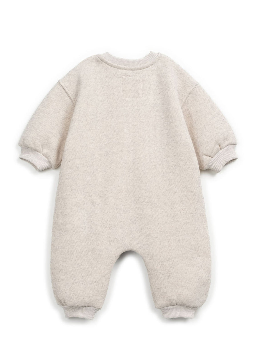 Beige baby snowsuit on a white background