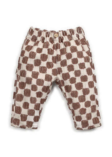 Checkered pants with brown and white pattern on a white background